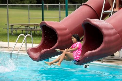 Girl on waterslide at Kings Landing Pool