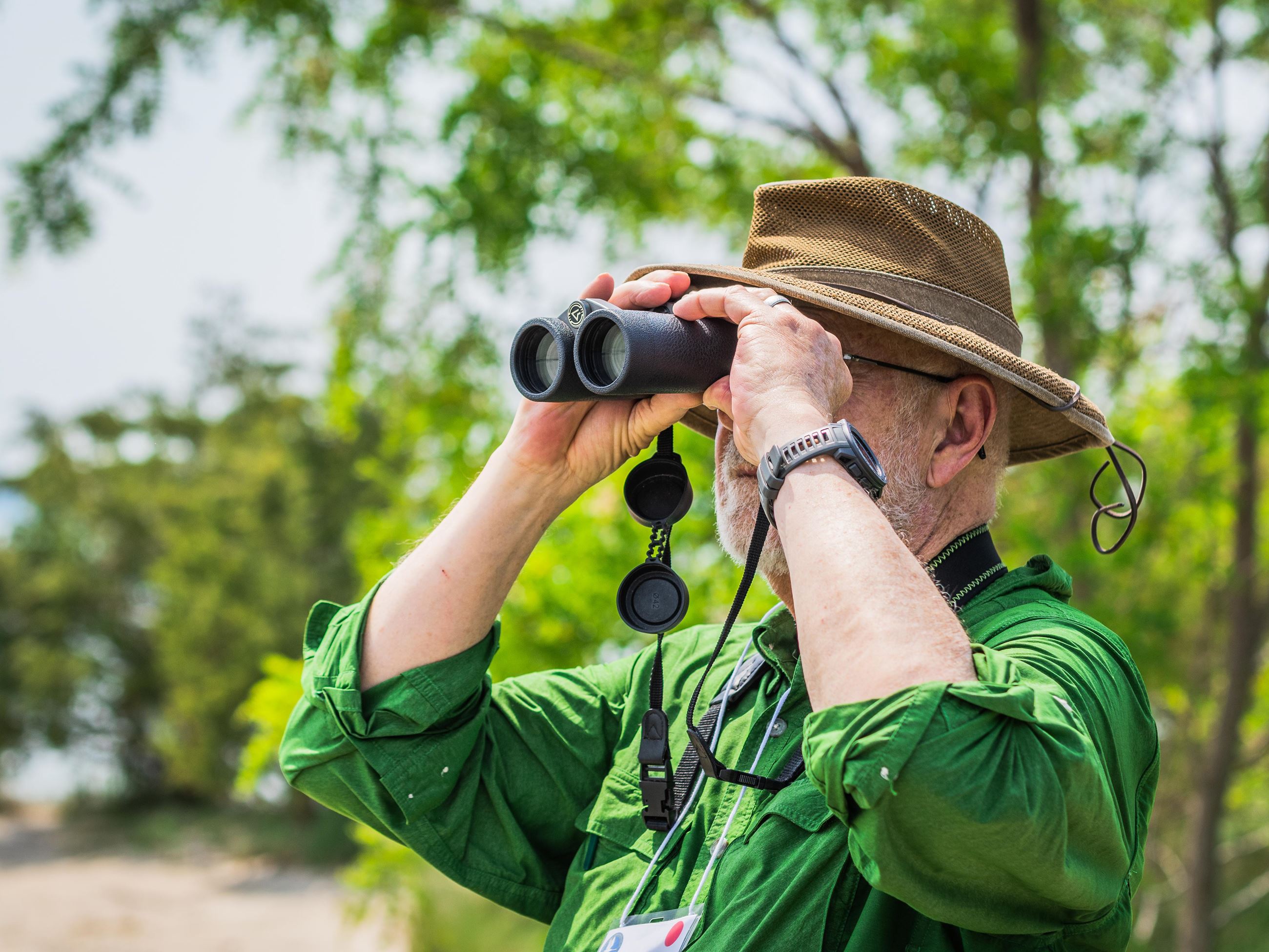 Man looking through binoculars