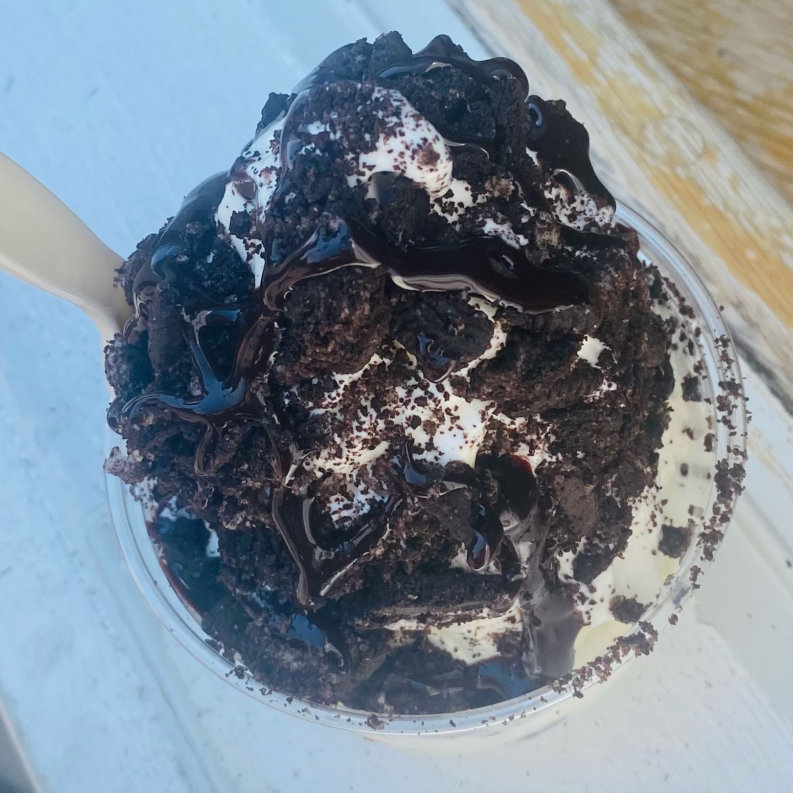 Cookies and cream ice cream cup with a spoon