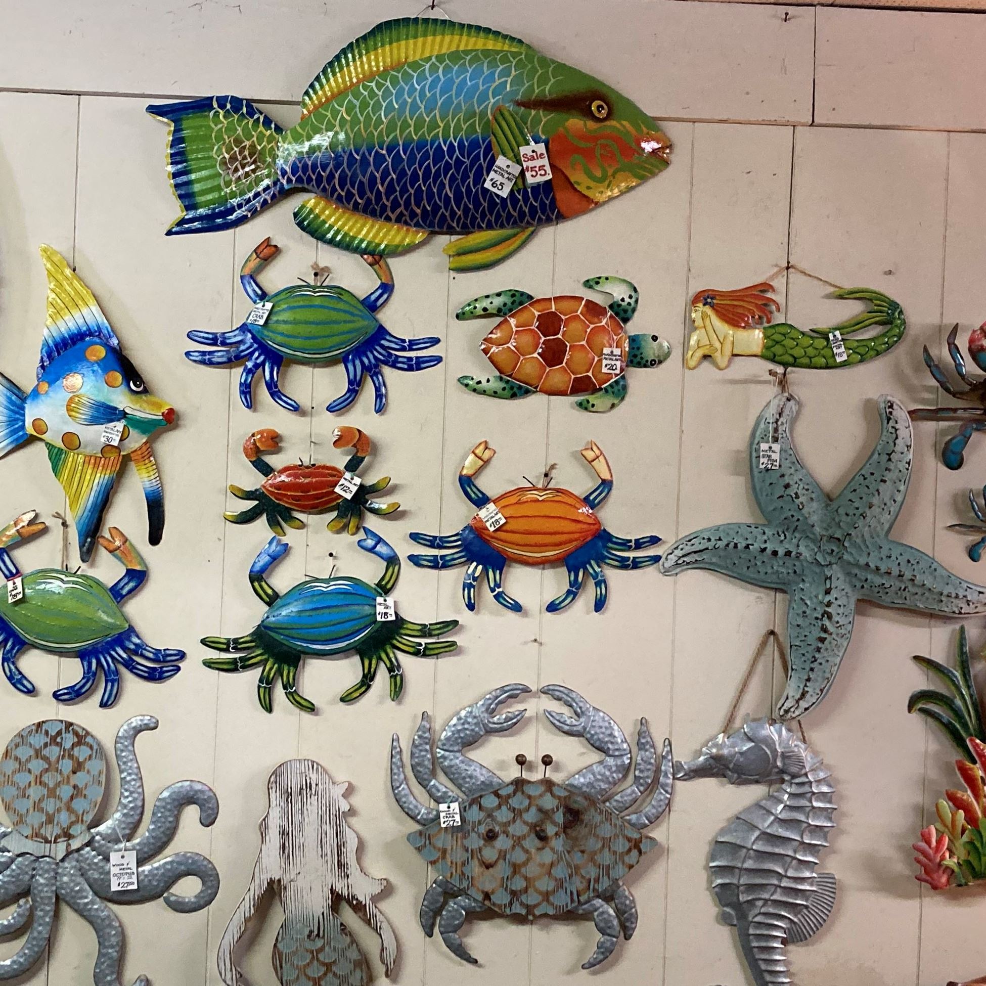 crabs and sea life decorations on a wall