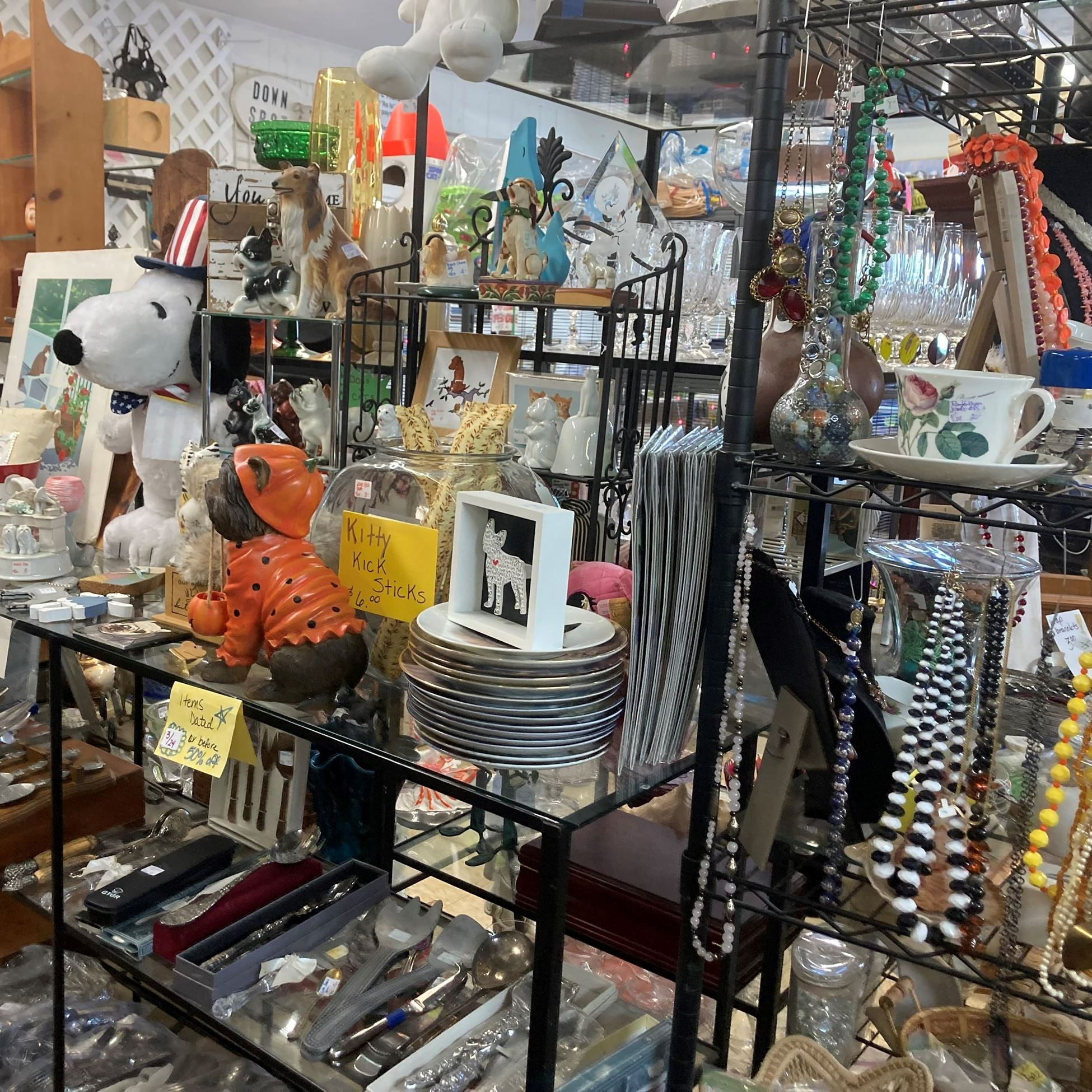 jewelry and other trinkets on shelves in a shop