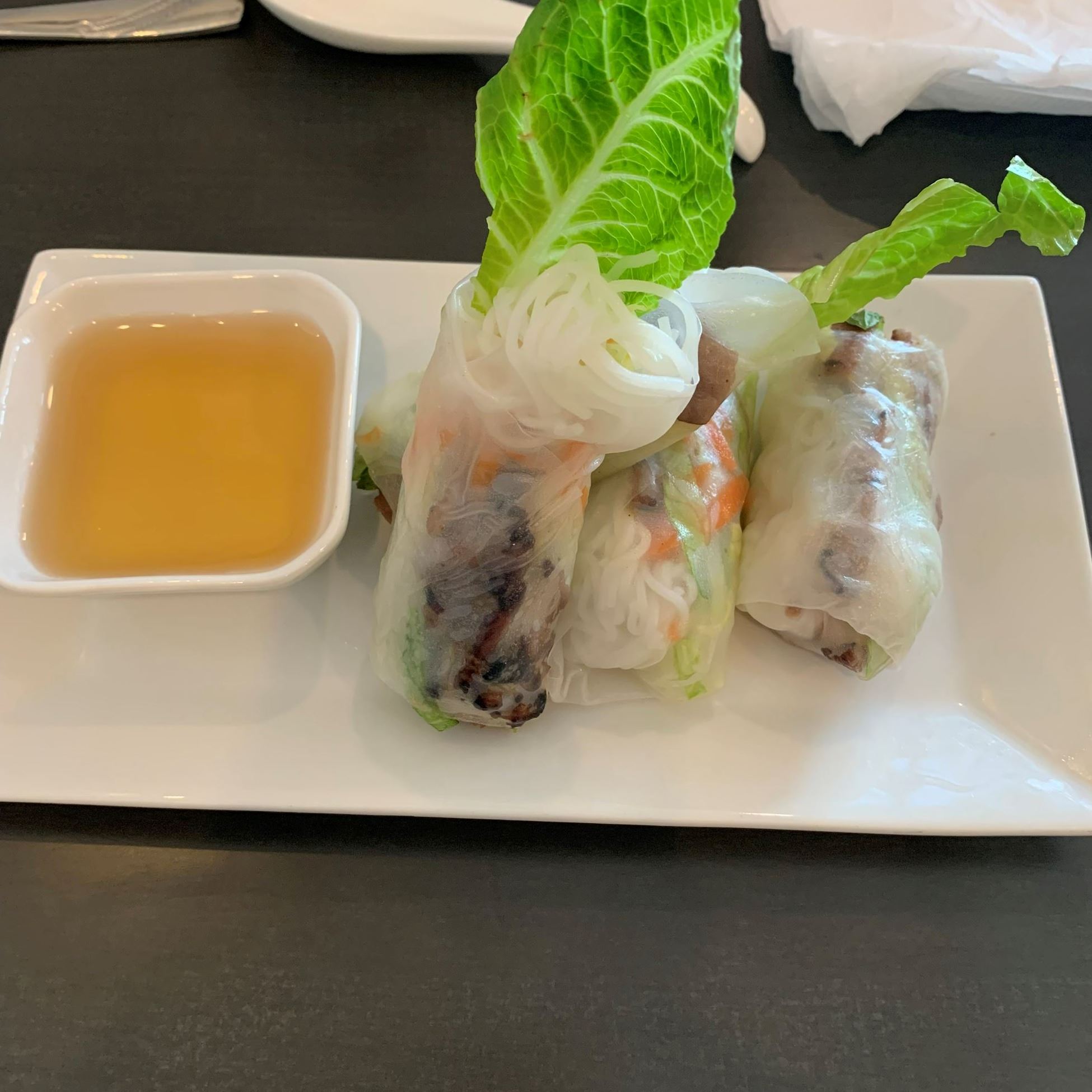 spring rolls on platter with dipping oil
