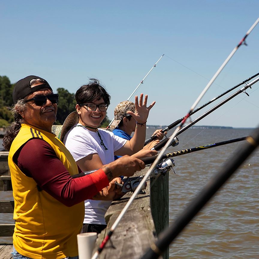 Two men fishing Opens in new window